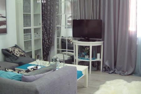 Уютная студия в скандинавском стиле.