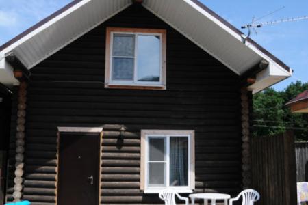 Двухэтажный дом из оцилиндрованного бревна